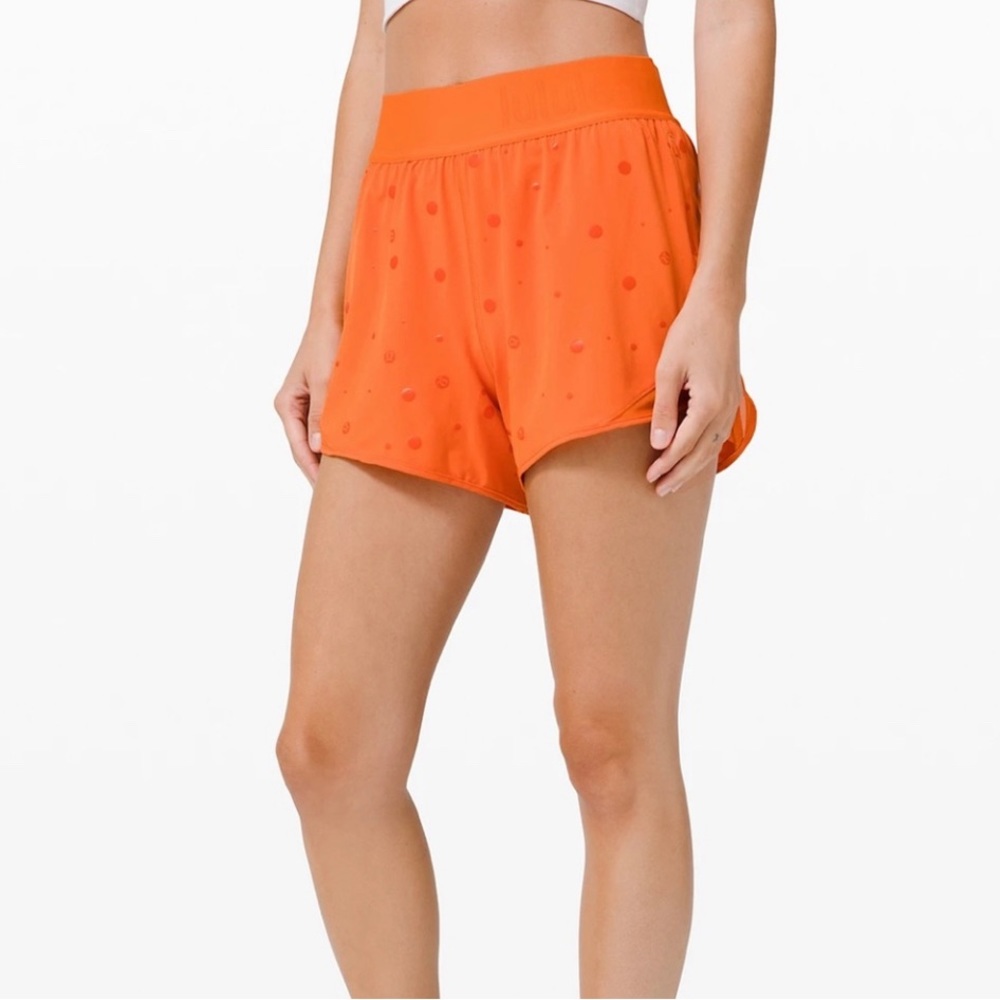 Lululuemon Hotty hot short 4”- logo foil orange